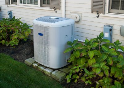 Residential air conditioning unit installed outside a home.